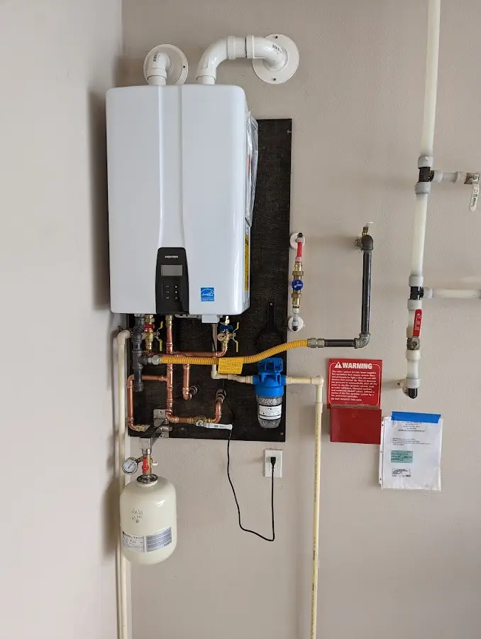 Professional plumber installing copper piping in a Donaldsonville home